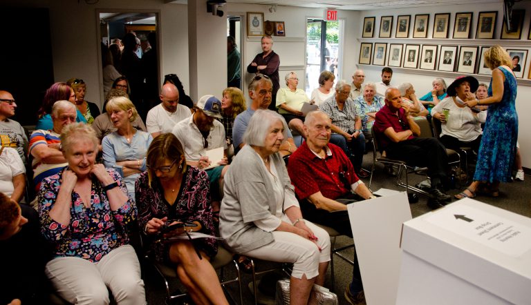 Residents fill City Hall to capacity during public hearing on housing project
