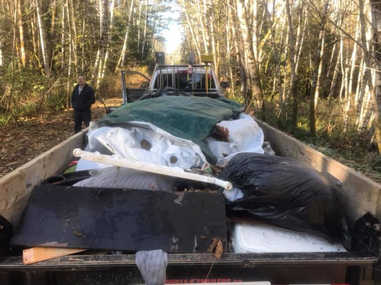 Volunteers pick up toys, roofing material, electronics off side of rural Campbell River road