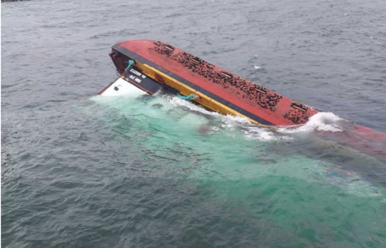 Capsized barge in Port McNeill will stay underwater until February 